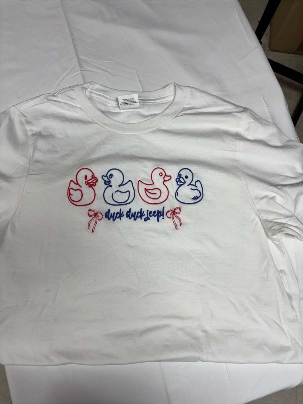 Woman’s Tee with Red & Blue Duck Embroidery. “Duck duck Jeep”for Jeep Lovers!